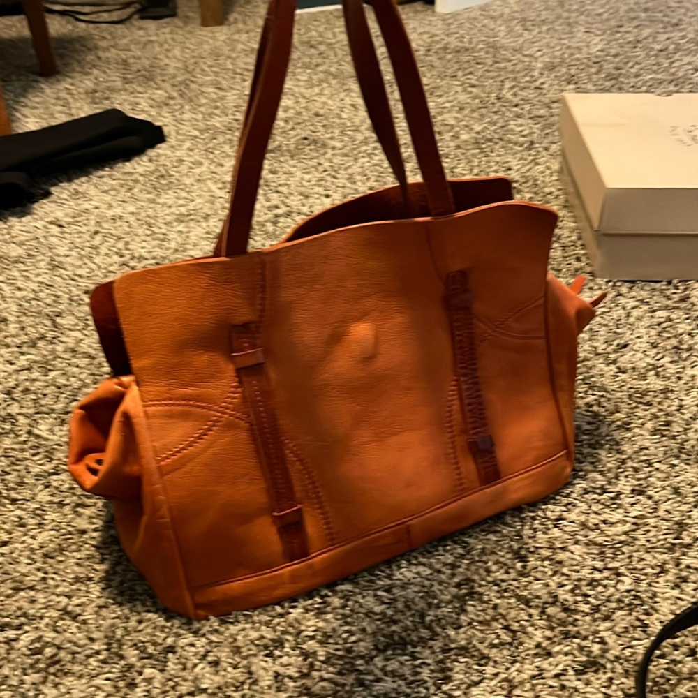 Holding horses satchel